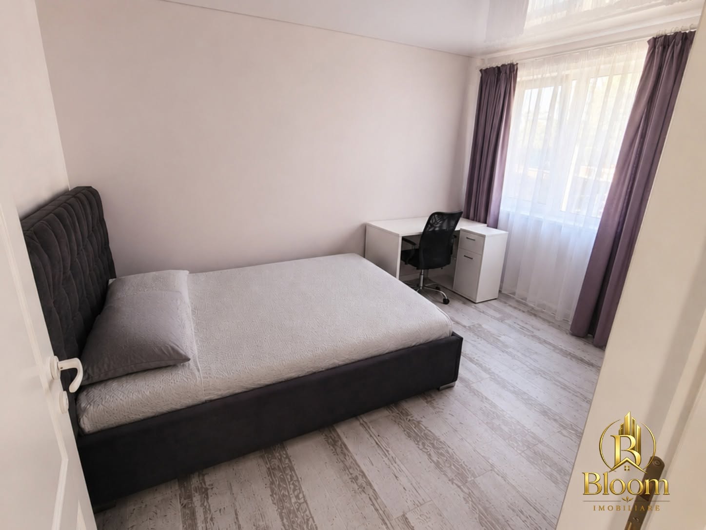 Dormitor secundar luminos și confortabil